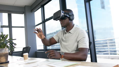 African-american-businessman-using-vr-headset-in-office,-slow-motion,-copy-space