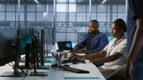 team of it professionals working in a server room