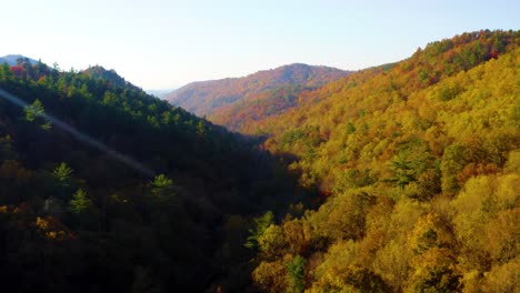 Flying-over-the-Fall-colors-as-a-sunrise-casts-a-shadow-over-the-mountains