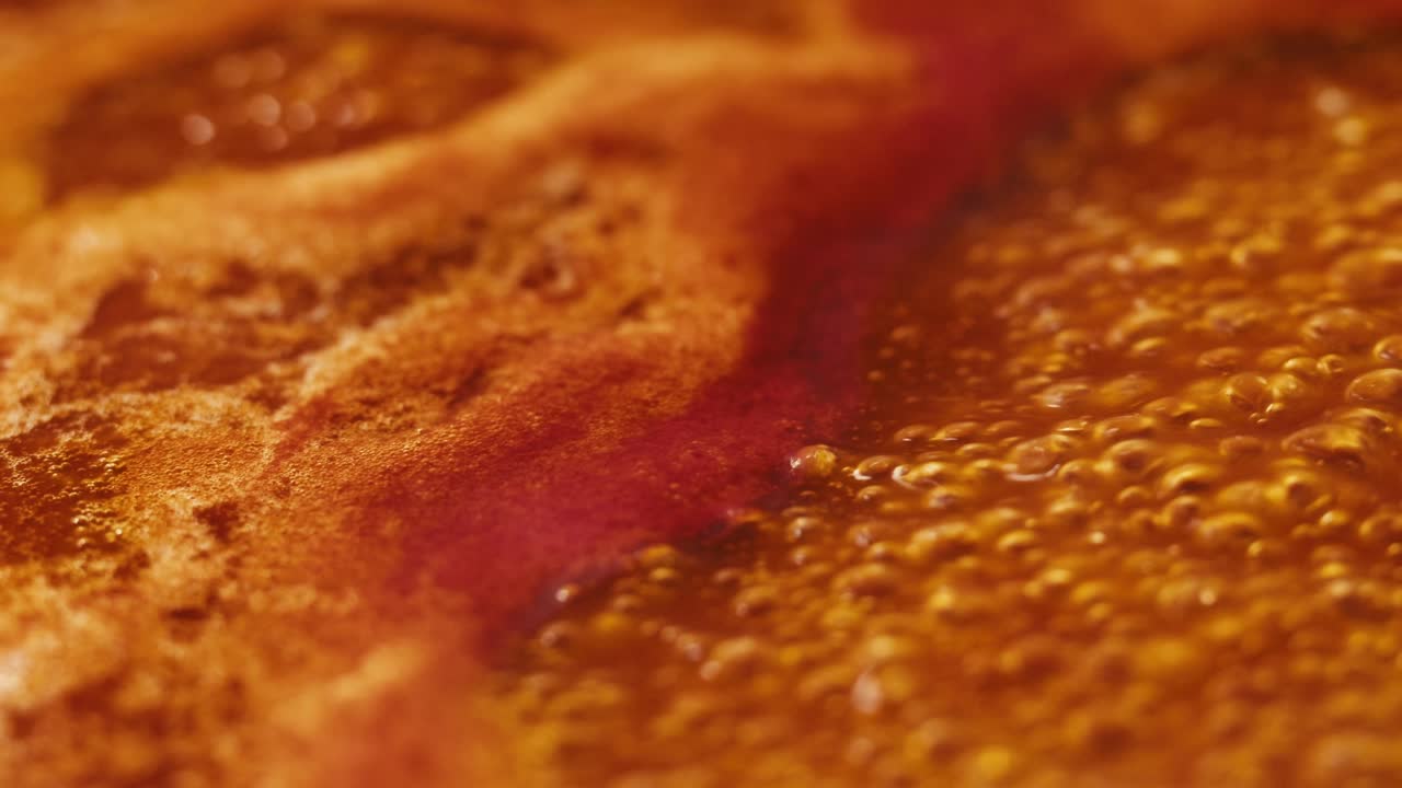 Chicken in tomato sauce is boiling on a frying pan with spices. Cooking tomato sauce curry with chicken fillet. Traditional Italian Mexican Asian dish. High quality studio shot for cafe, restaurant close up.