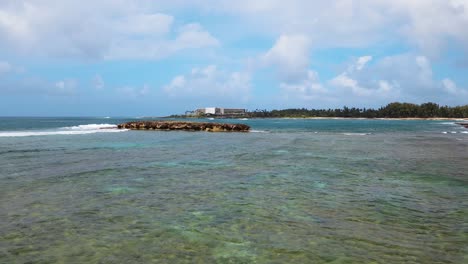 Fly-by-near-the-waters-of-the-turtle-beach-coastline-in-Oahu-Hawaii