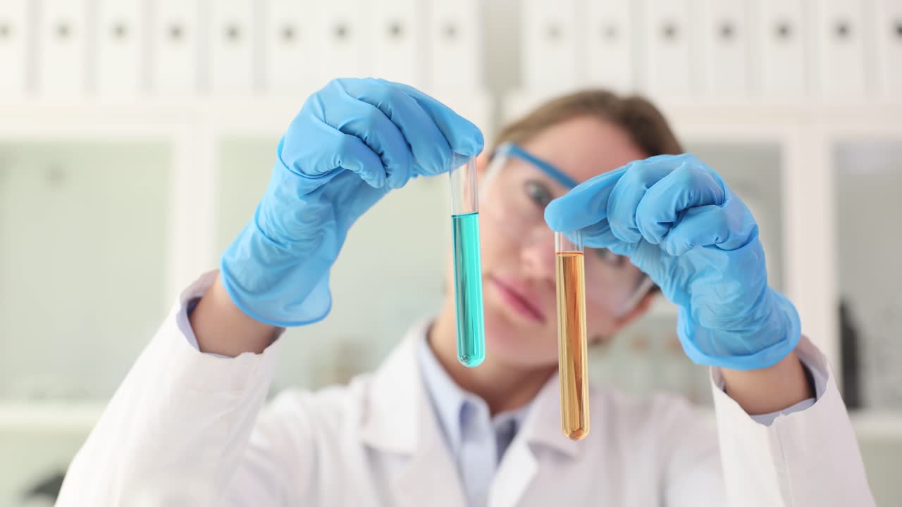 Scientist Holding Test Tubes in Laboratory