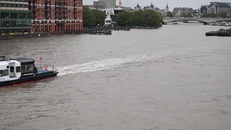 thames clippers, uber boat coming under blackfriars bridge, london, united kingdom