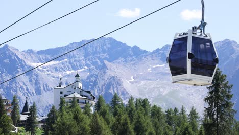 cable cars moving over lush green forest