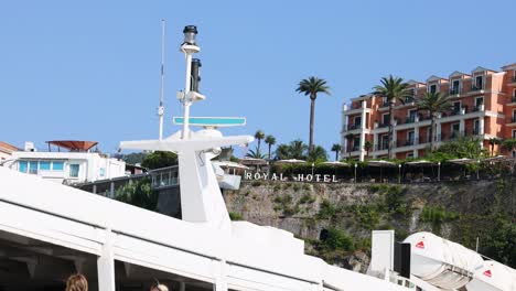 ship passing by a coastal hotel in sorrento