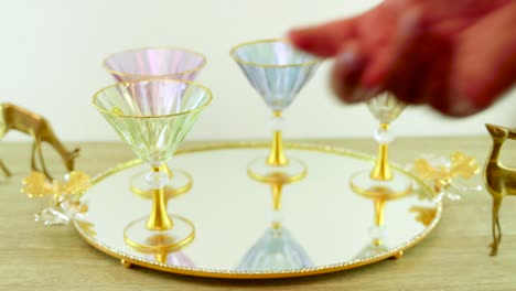 Placing-an-Elegant-Glass-on-a-Mirror-Tray