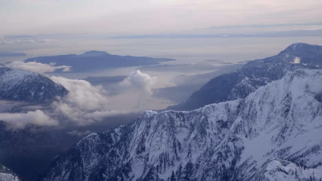 Bright-white-snowy-mountains-of-the-Squamish--Whistler-area-in-Canada--aerial