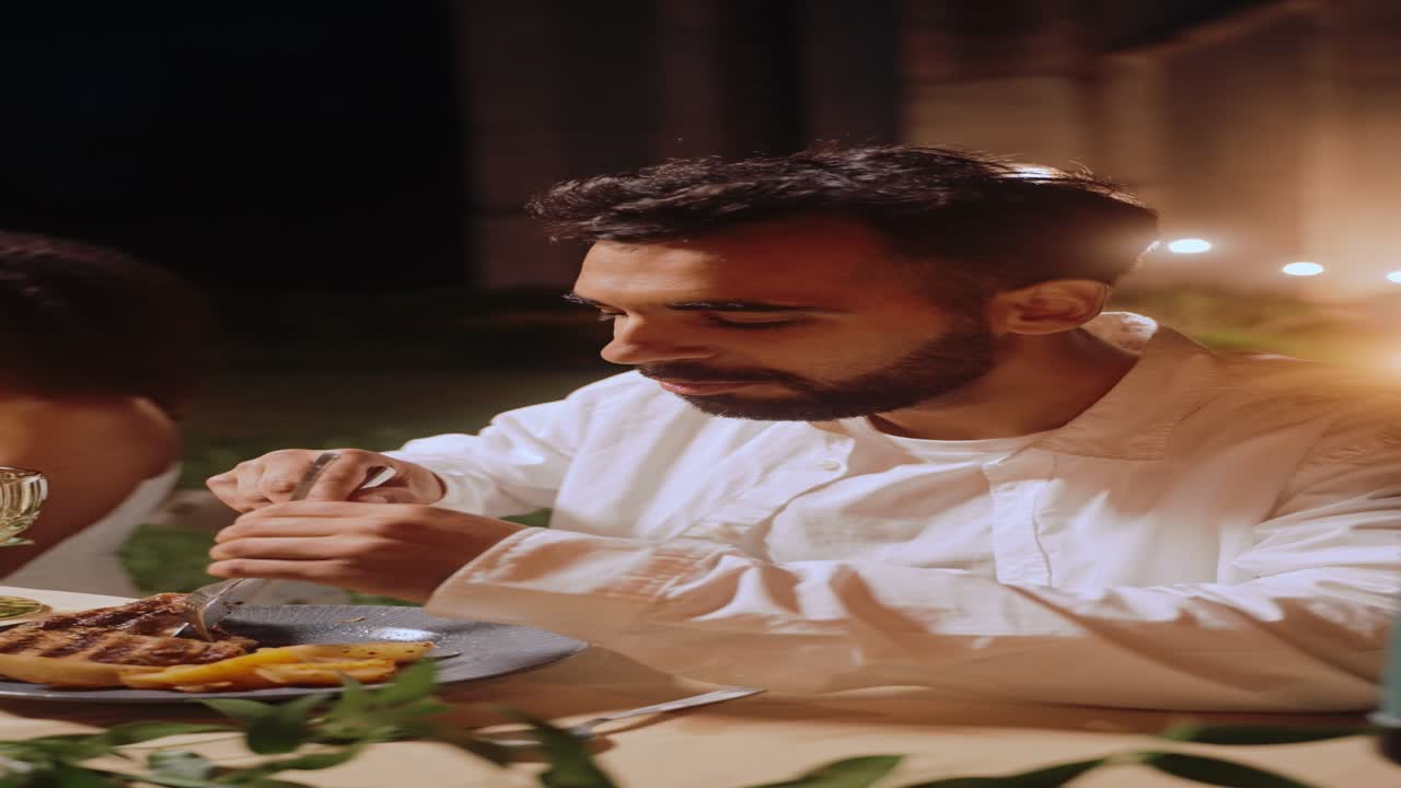 Man eating dinner at a table