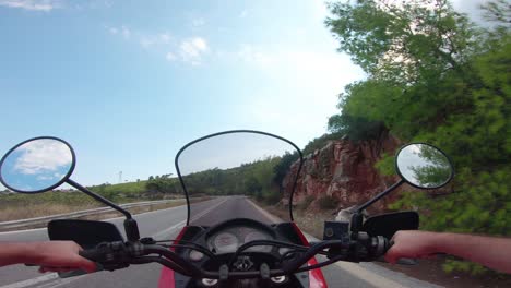 riding a motorcycle on penteli mountain in greece