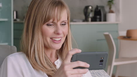 happy woman having video chat using smartphone mother waving at baby smiling enjoying chatting on mobile phone at home