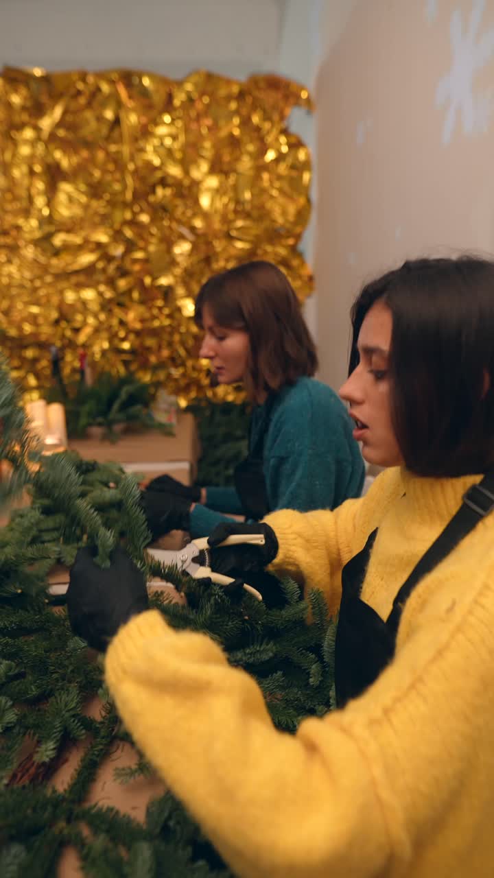 People Making Christmas Wreaths