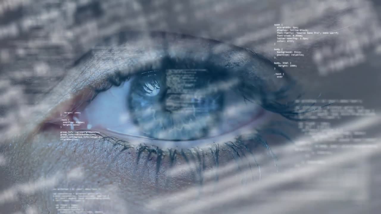 Animation of data processing over close up of woman's eye