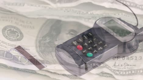 Animation-of-dollar-banknotes-falling-over-payment-terminal