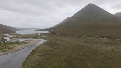 glamaig mountain aerial rise up shot above river sligachan