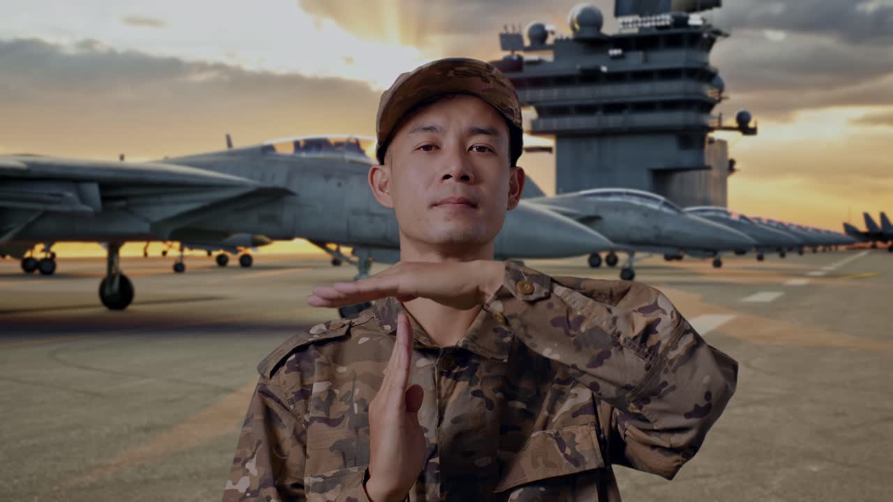 Military Personnel Gesturing 'Time Out' on Aircraft Carrier Deck at Sunset