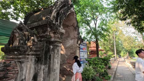 group of tourists taking photos at historical site