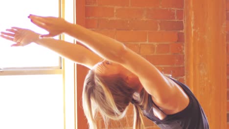 Woman-performing-stretching-exercise