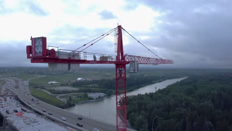 crane by busy highway bridge construction zone approaching