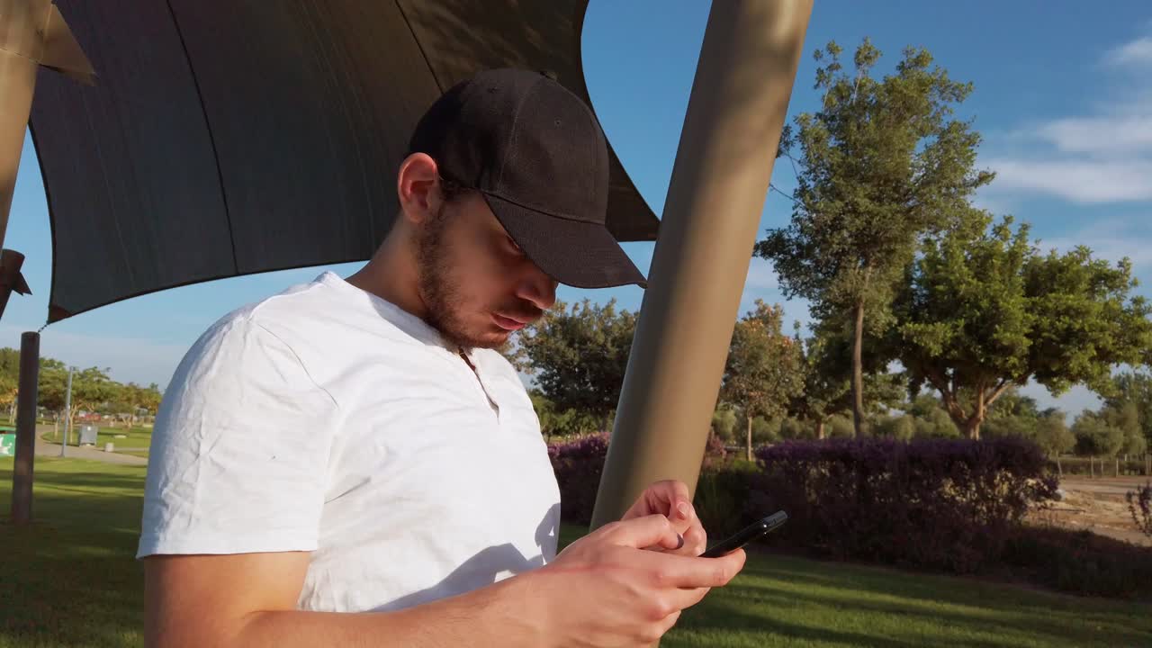 young man checking his mobile phone