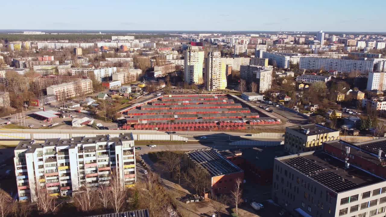 Aerial drone view with red colored storage warehouses of residential district in eastern european city. Large apartment buildings in urban area.