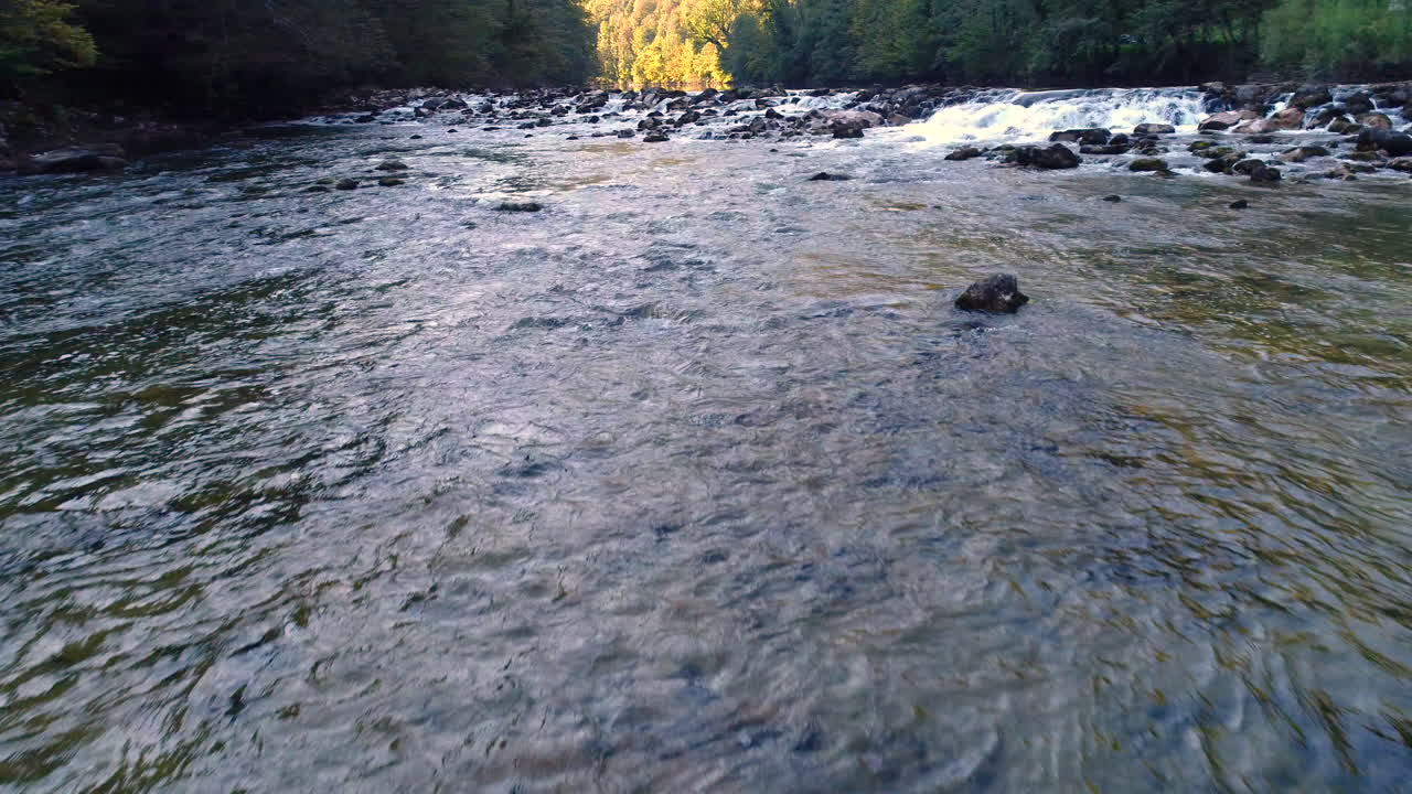 Low angle view of the Kolpa river, Kostel. water splashes over and around rocks