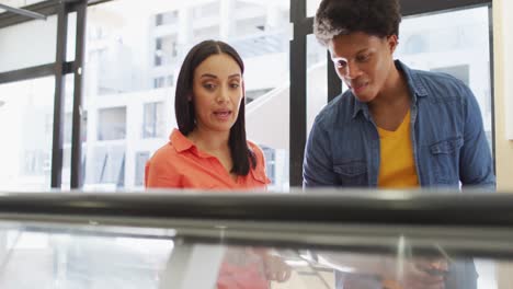 Video-of-happy-diverse-female-and-male-customers-choosing-food