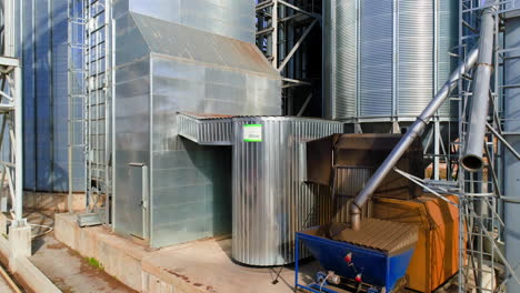 elevator for storing agricultural products. aerial view of drone on large granary in field