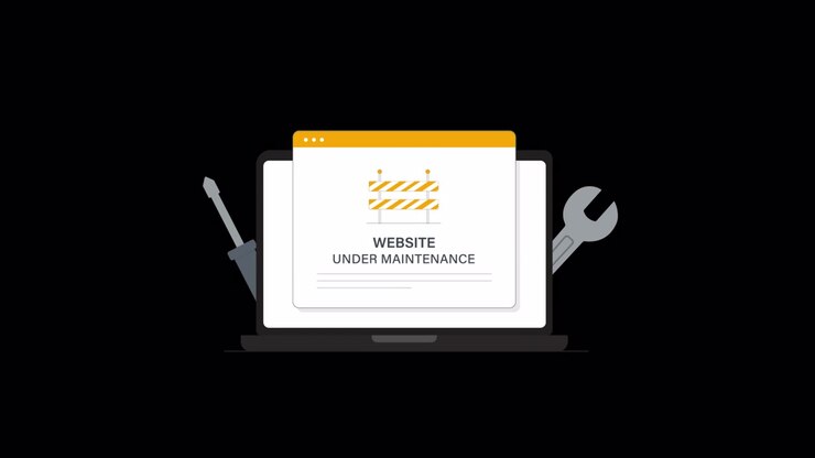 Animated Website Under Maintenance Notification on Laptop Screen