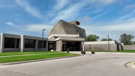 pulling away from an imposing modernist building