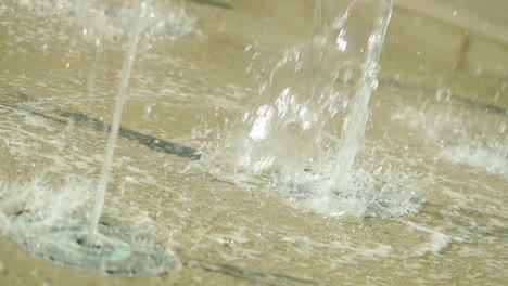 two small floor fountains in slow motion