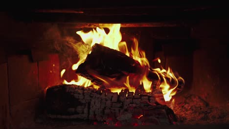 slow-motion and close-up of burning wood. handheld