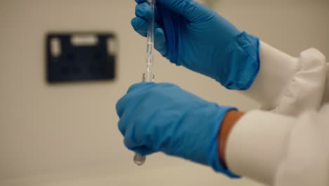 scientist examining blood samples in test tubes