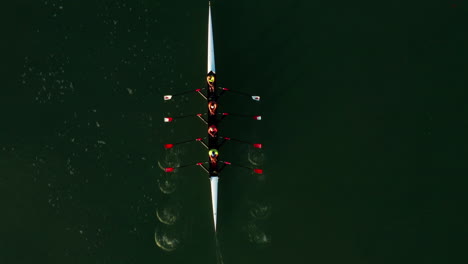 Directly-above-aerial-shot-of-simultaneous-rowing-coxless-quadruple-scull