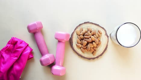 healthy lifestyle: almond milk, almonds, and dumbbells