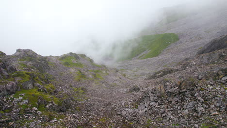 rock hills with algae drone shot clouds covered at nepal himalaya region 4k