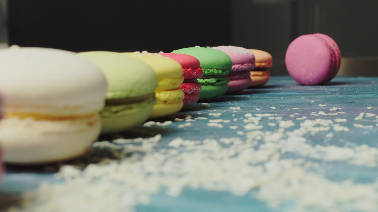 Colorful Macarons on a Blue Surface