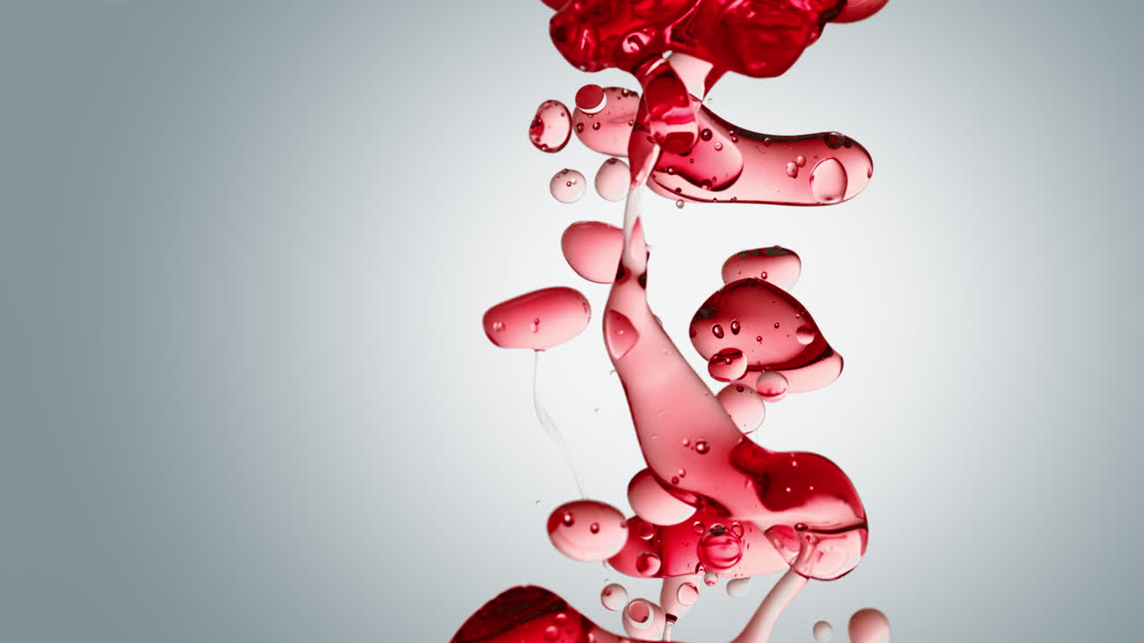 흰색 그라데이션 배경의 정제수에 투명한 빨간색 오일 거품과 유체 모양