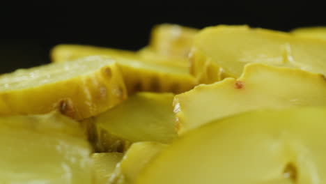 close-up of sliced pickled cucumbers
