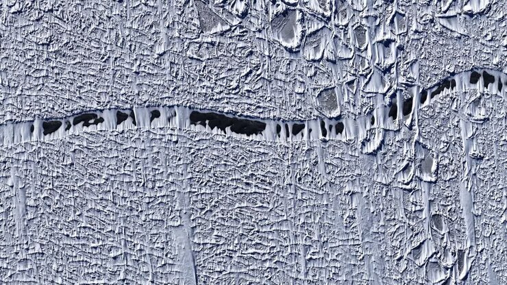 Aerial view of ice texture in Latvia, showcasing nature's intricate patterns