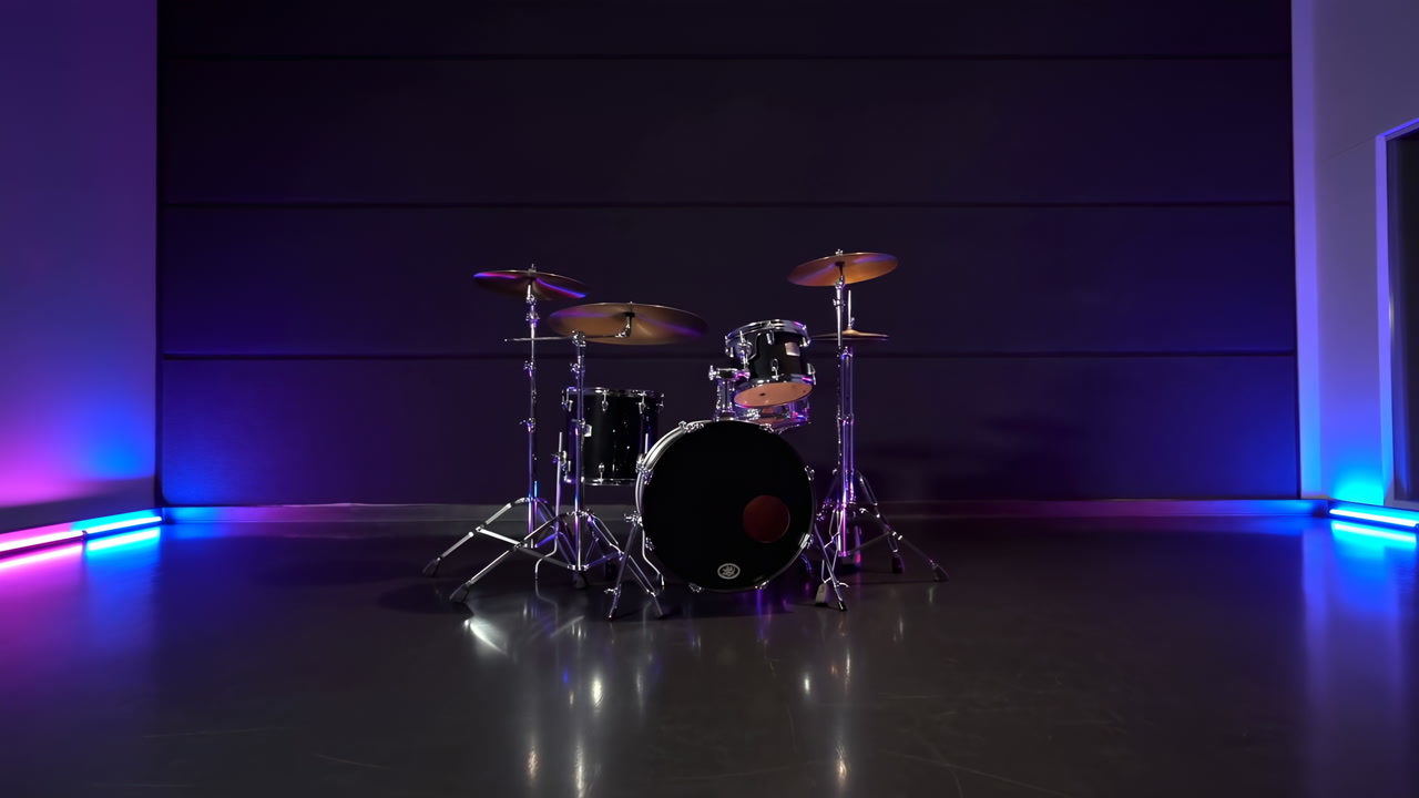 Empty Studio Stage With Drum Kit, Dark Paneled Wall, Purple And Blue LED Accent Lighting, Reflective Concrete