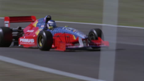 a race car speeds between two turns