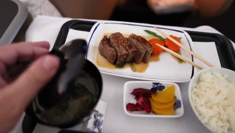 opening miso soup with steak and vegetables