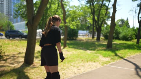 teenage girl rollerblading in a park