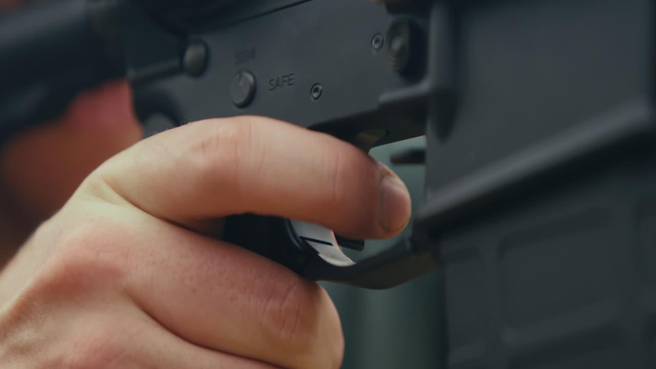 Hand on a gun trigger