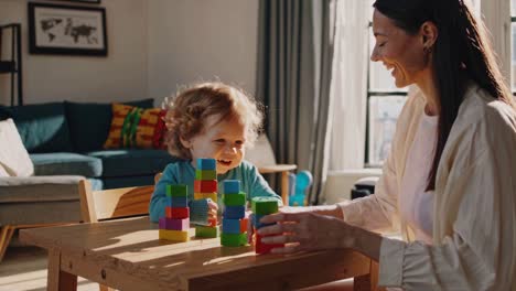 mother and child playing with blocks