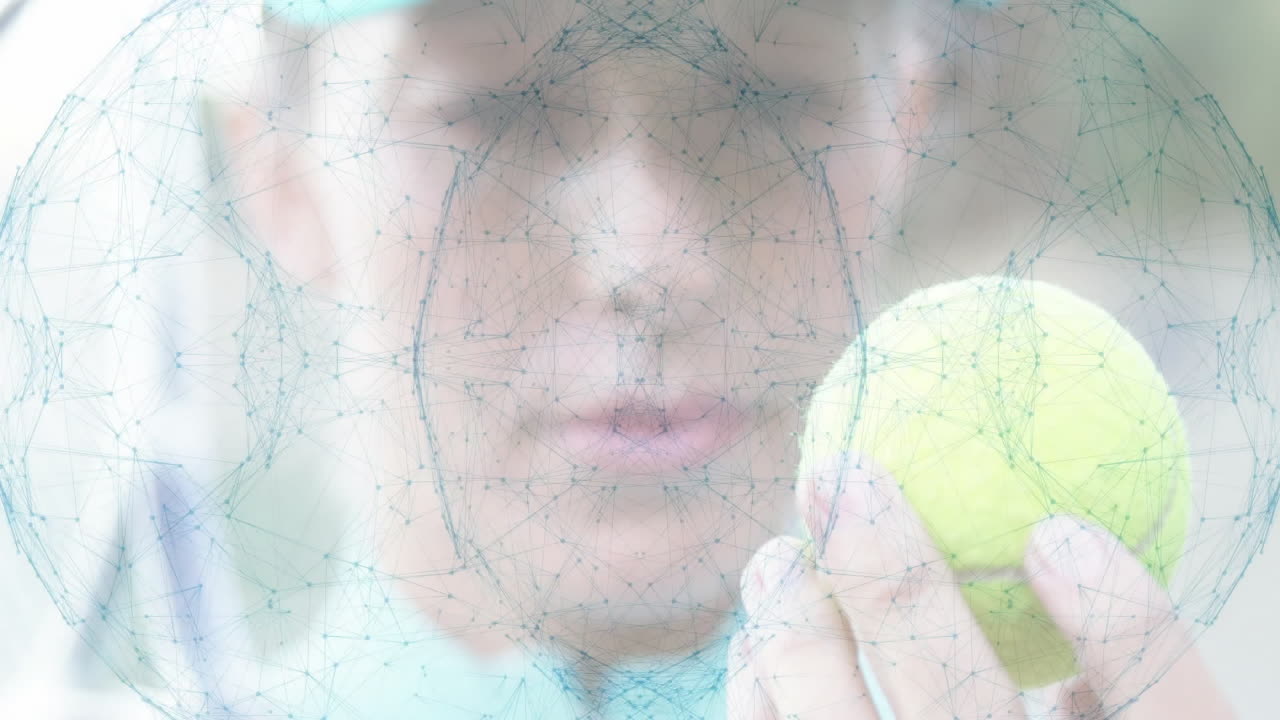 Female tennis player holding tennis ball close to camera showcasing digital technology overlay