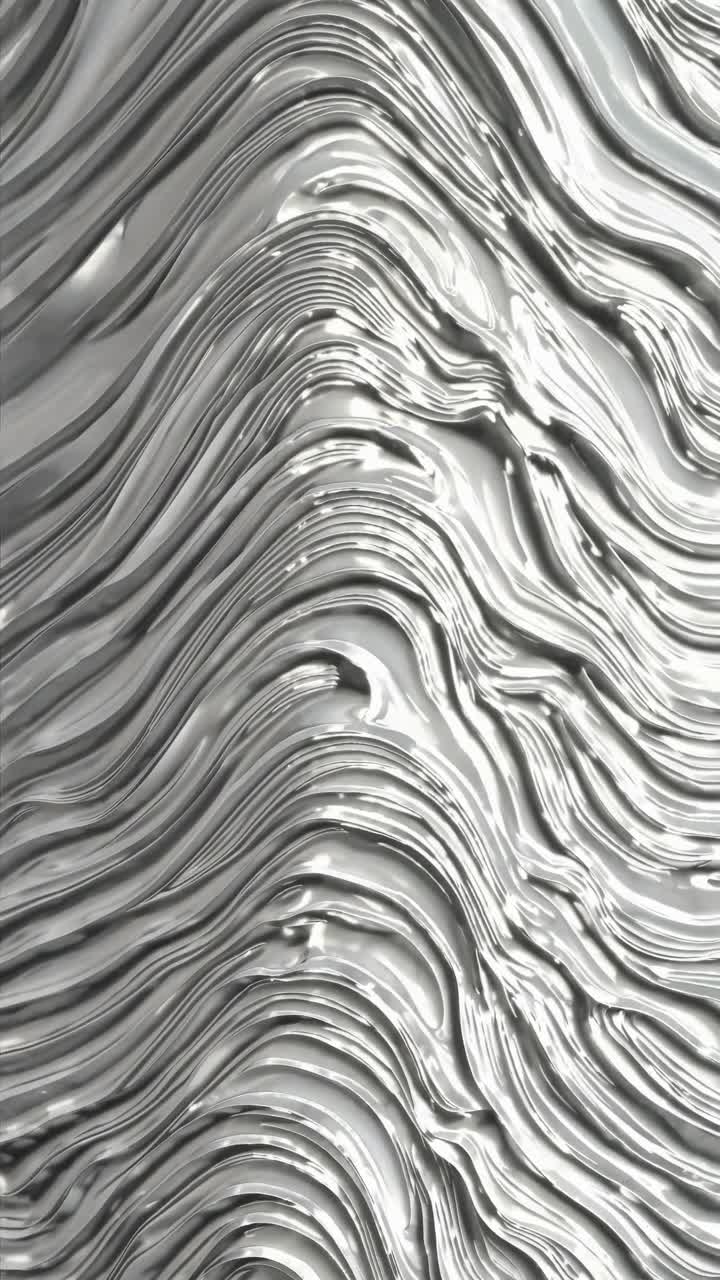 Concetto video astratto con linee fluide e ondulate che ricordano il metallo liquido