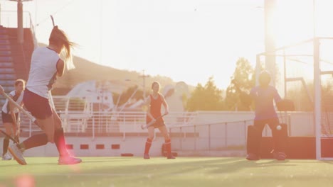 Female-hockey-players-playing-on-the-field