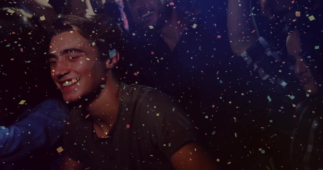 Central man reacting to falling confetti, turning, reaching for blue phone during celebration
