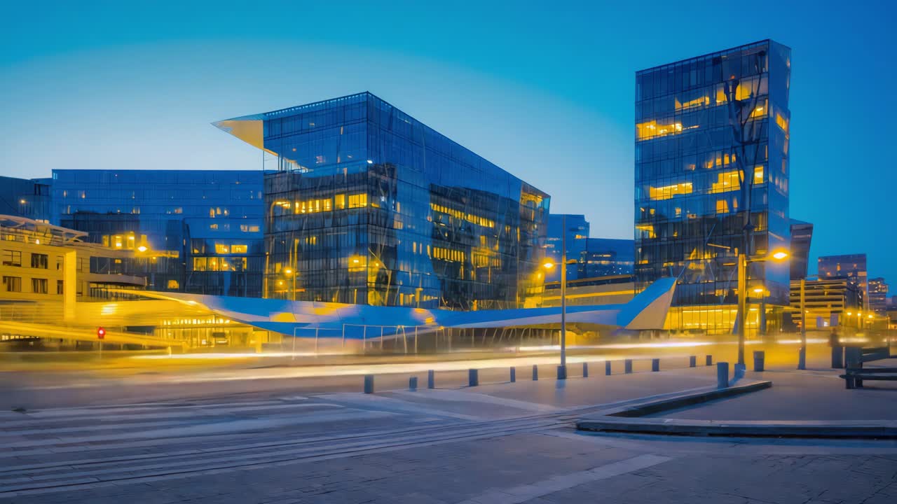 Modern Cityscape at Dusk with Illuminated Glass Buildings and Light Trails